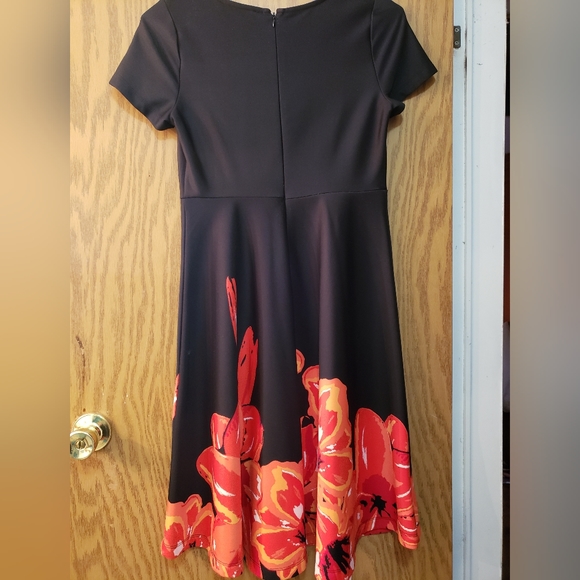Very pretty black dress with orange/red floral pattern on the bottom. - Picture 3 of 6